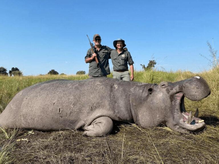 Author Pierre van Wyk poses with his hippo and the local outfitter during his hippo hunting safari in Namibia