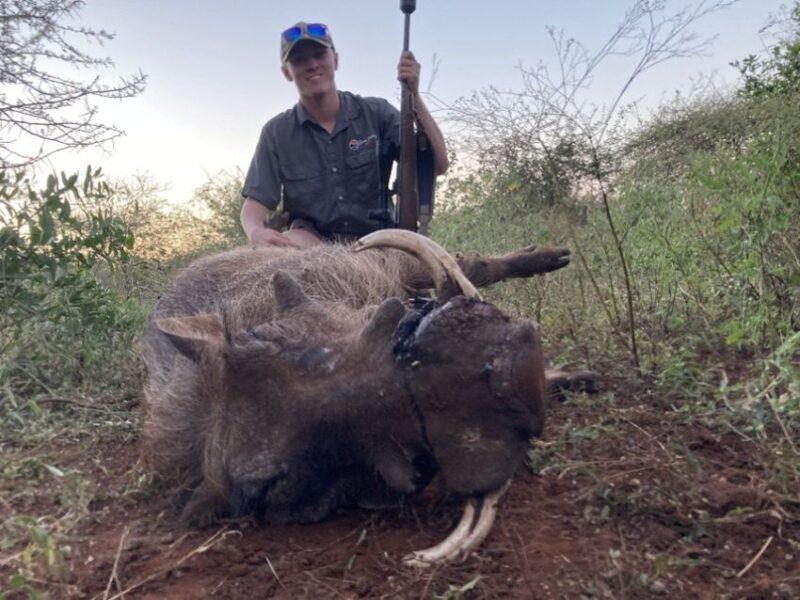 Image of man with warthog